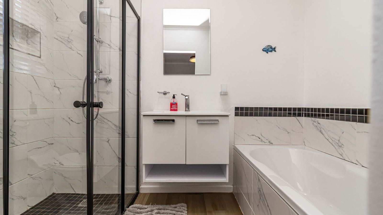 En-suite bathroom with bath and shower